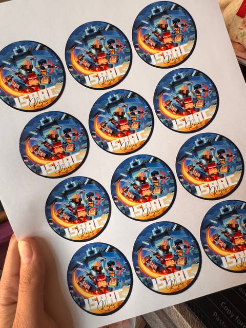 Sheet of circular stickers featuring Santa and reindeer flying in a sleigh against a snowy night sky background