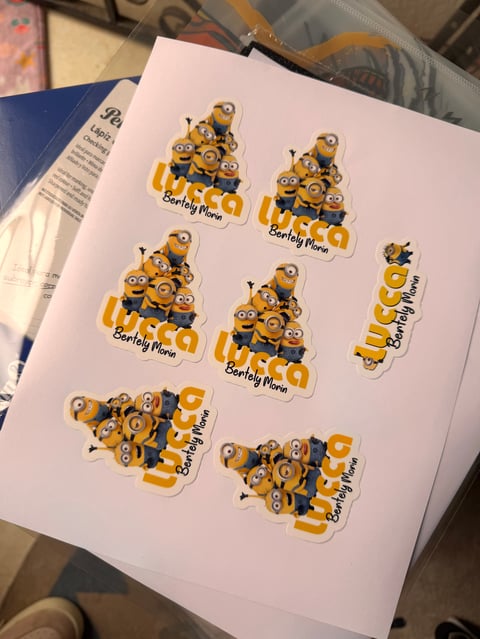 Sheet of Minion stickers arranged in rows with Barely Mine text label on white paper